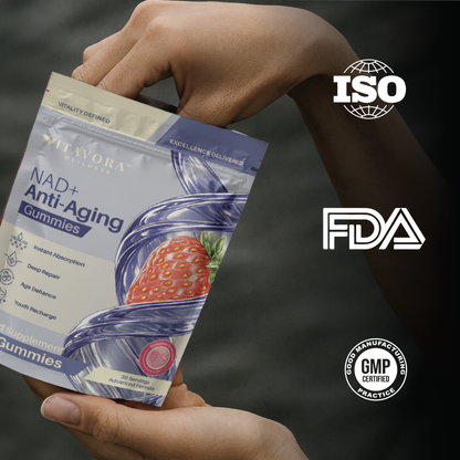 Hand holding a Vitavora Wellness NAD+ Anti-Aging Gummies pouch with strawberry infusion styling, next to ISO, FDA, and GMP Certified Good Manufacturing Practice trust badges.